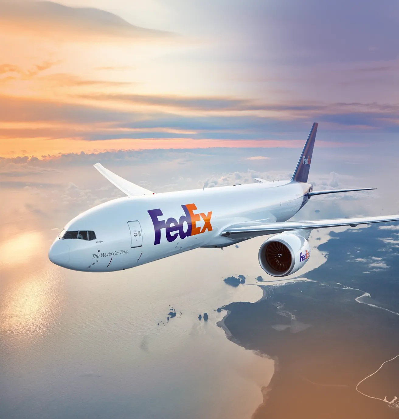 FedEx cargo aircraft in flight over the coast